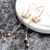 Picture of Copper or Brass Rose Gold Plated Dangle Earrings in Flattering Style