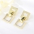 Picture of Wholesale Gold Plated White Dangle Earrings with No-Risk Return